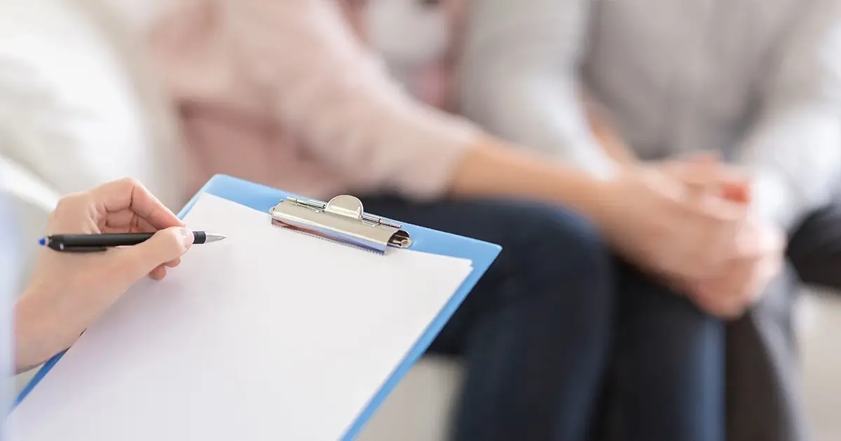 Therapist taking patient notes